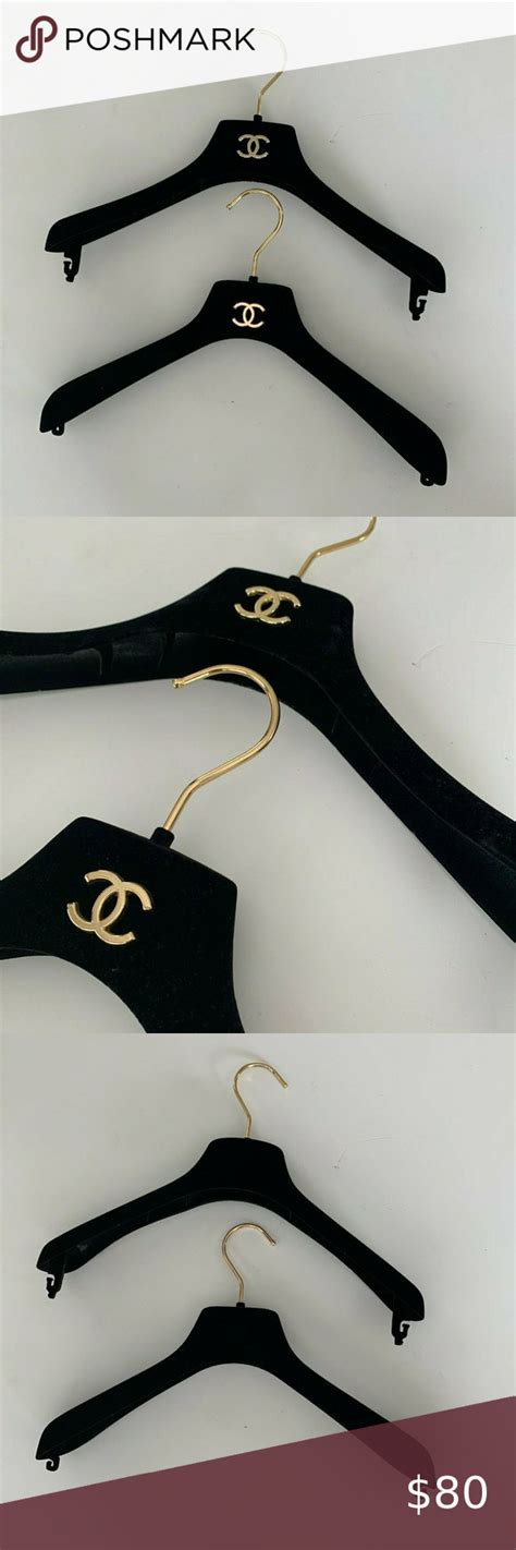 Chanel. Two Black Velvet Gold Logo Coat Hangers and Chanel 